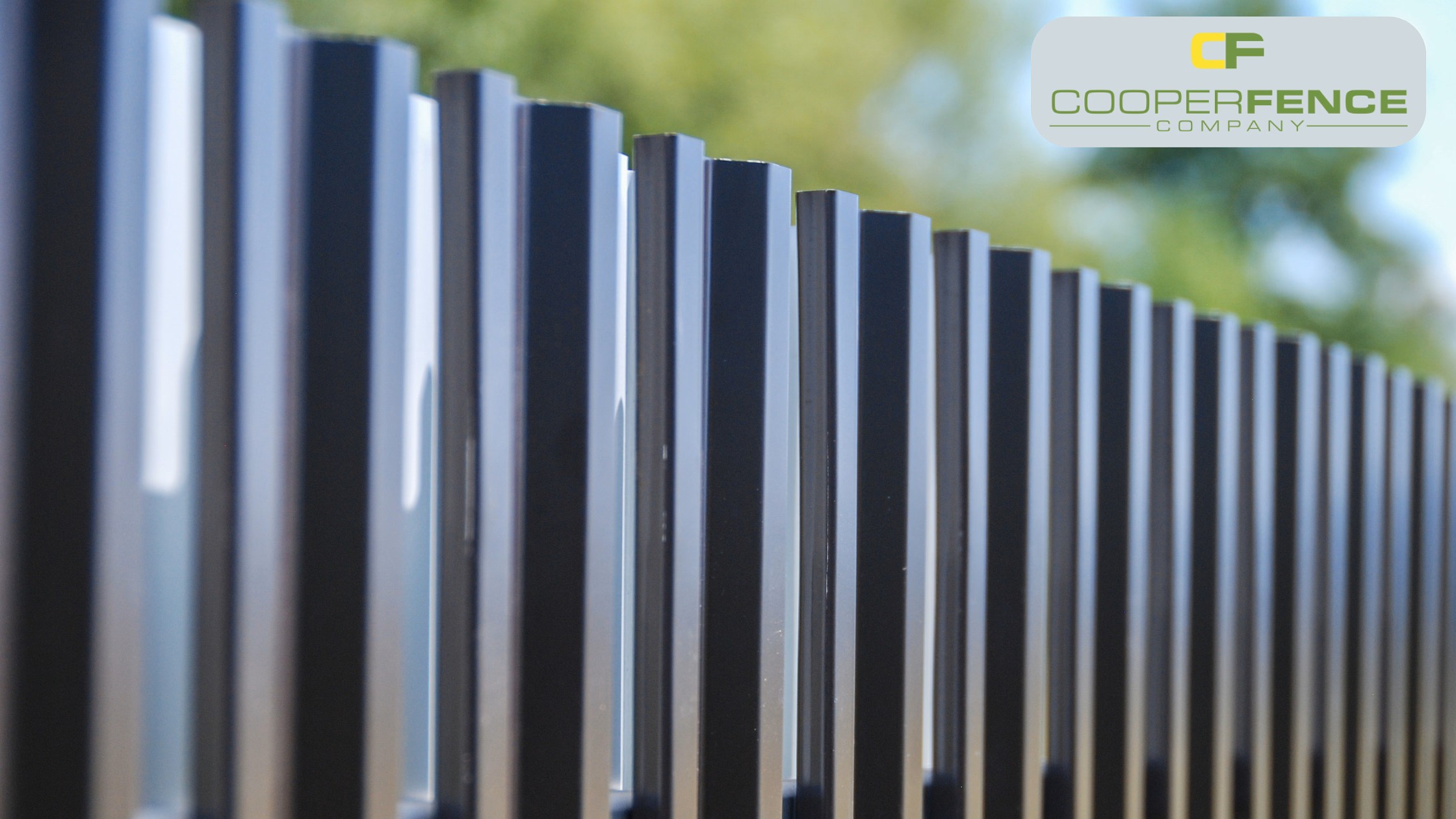 A secure, commercial-grade galvanized chain link fence installed at a business facility in Baldwin County.